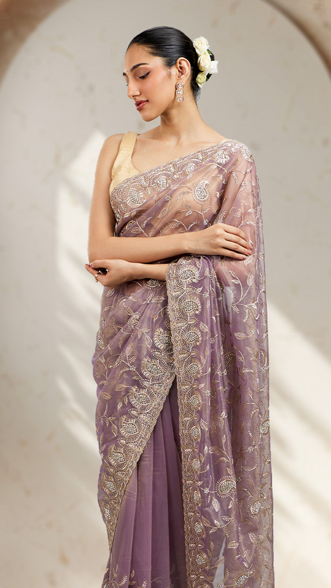 Women flaunting her beautifull purple net saree